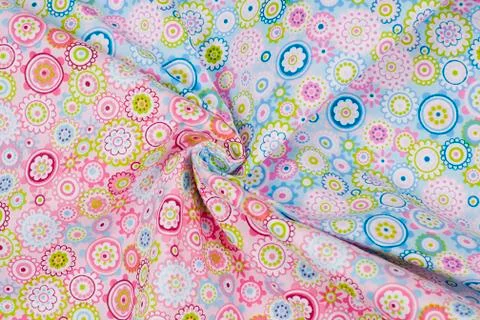 Stack of colorful clothes on wood table housework and objects concept Foto stock