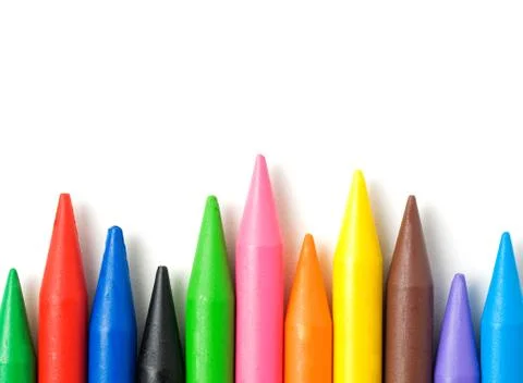A stack of colorful crayons isolated on white background. Foto stock