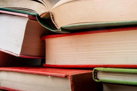 Stack of colorful educational books arranged neatly on a surface for study and Stock Photos
