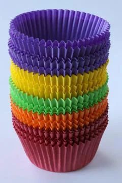 Stack of colorful empty paper forms capsules for muffins and cupcakes Stock Photos