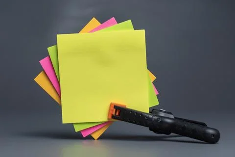 Stack of colorful empty sticky notes with copy space on gray background Stock Photos