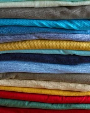 Stack Of Colorful Folded Clothes Close Up, Textile Fabric Texture Backgroun.. Stock Photos