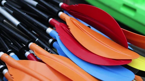Stack of colorful kayak oars. Stock Footage 303370306