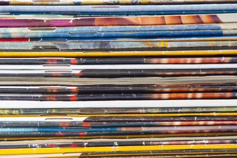 Stack of colorful magazines or documents - paper edges background Stock Photos
