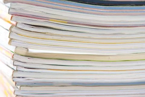 Stack of colorful magazines or documents - paper edges background Stock Photos