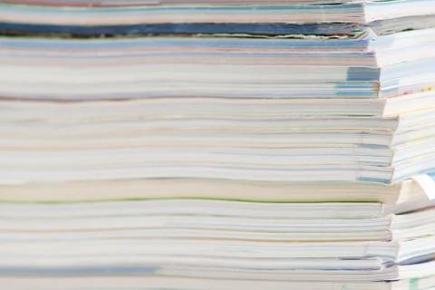Stack of colorful magazines or documents - paper edges background Stock Photos