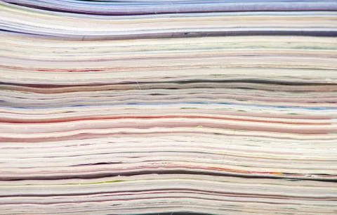 Stack of colorful magazines or documents - paper edges background Stock Photos