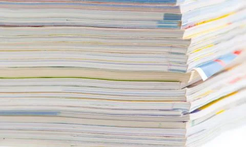Stack of colorful magazines or documents - paper edges background Stock Photos