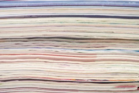 Stack of colorful magazines or documents - paper edges background Stock Photos