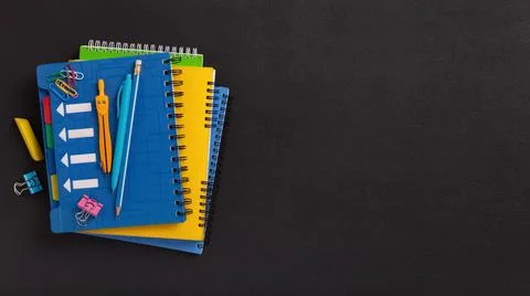 Stack of colorful notebooks of a student or school pupil Stock Photos
