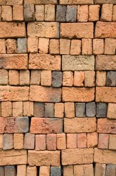 A stack of colorful old clay bricks Foto stock