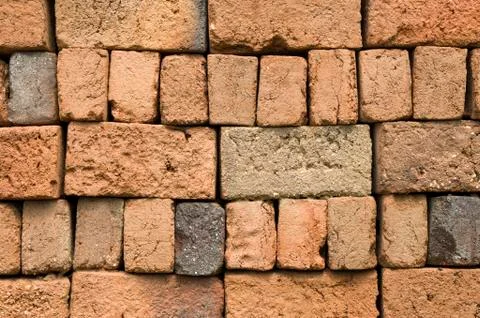 A stack of colorful old clay bricks Foto stock