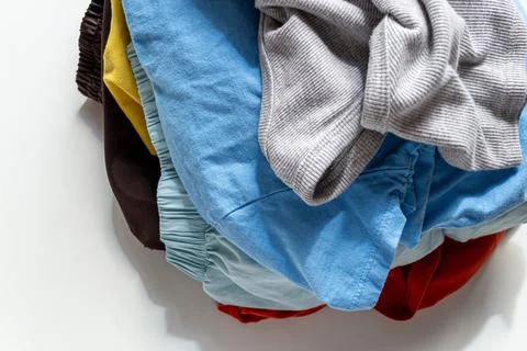 Stack of colorful old clothes for recycling Stock Photos