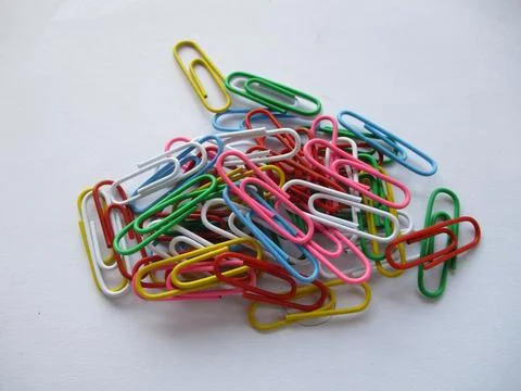 A stack of colorful paper clips isolated on white background Stock Photos