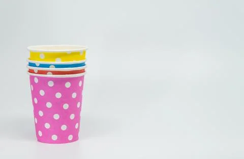 Stack of Colorful paper cup on white background and selective focus Stock Photos