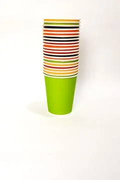 Stack of Colorful Paper Cups on White Background: Party Supplies and Essentia Stock Photos
