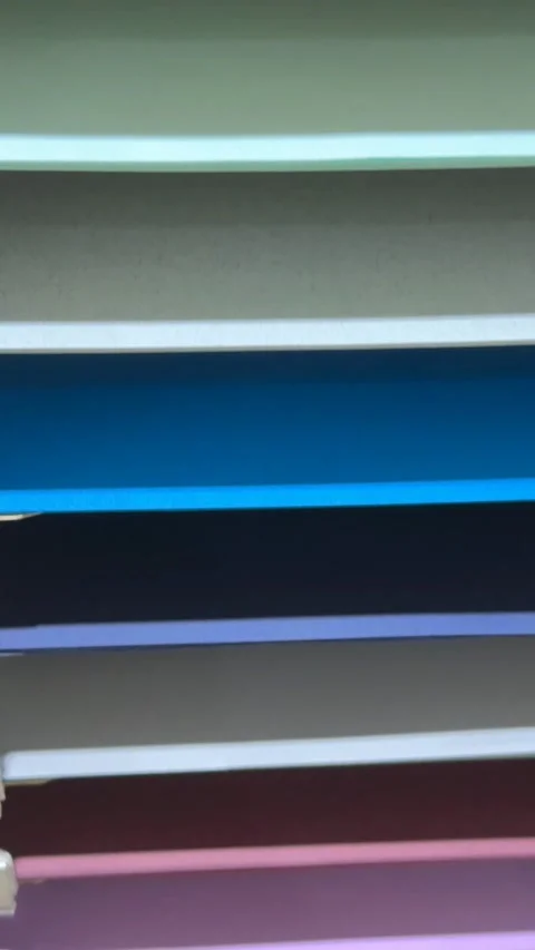 Stack of colorful paper sheets in a vertical arrangement creating a vibrant.. Stock Footage 314426266