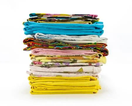 A stack of colorful pillowcases over a white background Foto stock