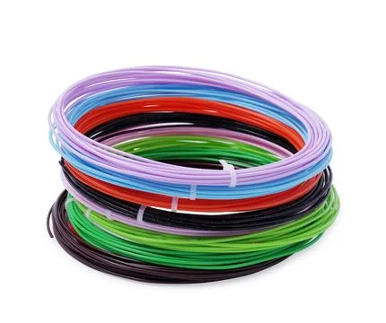 Stack of colorful plastic filaments for 3D pen on white background Foto stock