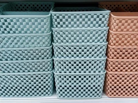 Stack of Colorful Plastic Storage Baskets for Home Organization Stock Photos