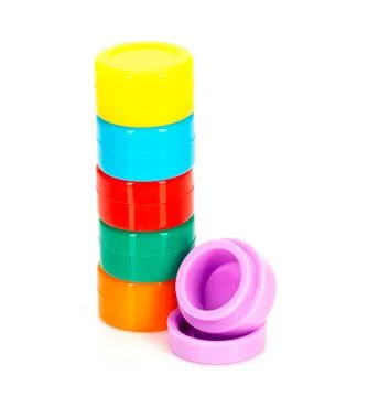 Stack of Colorful Plastic Storage Containers on White Background Stock Photos