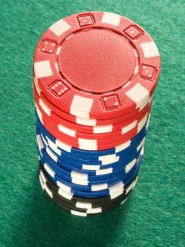 A stack of colorful poker chips. Stock Photos