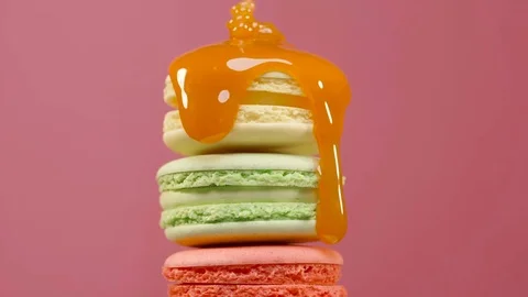 Stack of colorful rotating macaroons on color background Stock Footage 82904446