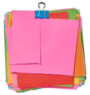 Stack of colorful square sticky notes with jagged edges, secured with a blu.. Foto stock