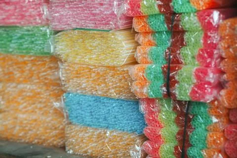 Stack of colorful straws, inside plastic packaging 스톡 사진