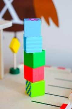 Stack of colorful toy cubes on a blurred background Stockfoto's