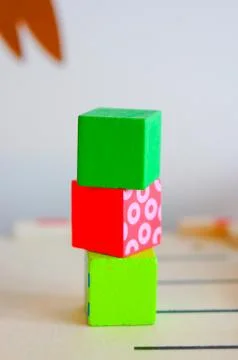 Stack of colorful toy cubes on a blurred background 스톡 사진
