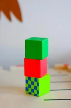 Stack of colorful toy cubes on a blurred background Stockfoto's