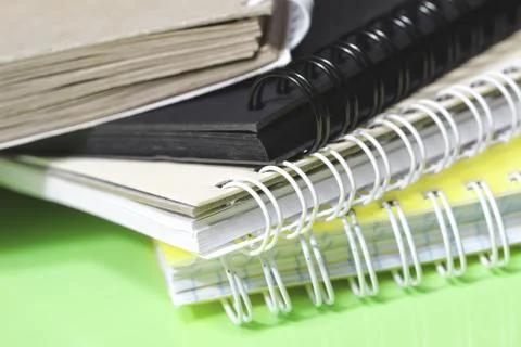 Stack of colourful notebooks with spiral edge Stock Photos