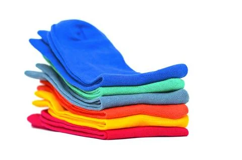 Stack of colours unisex socks isolated on white background, space for text Фото