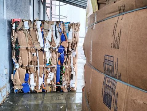 A stack of composite material boxes rests on each other Stock Photos