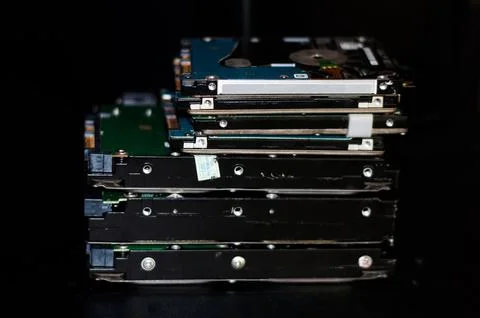 Stack of computer Hard disk drives and laptop Hard disk drives Stock Photos