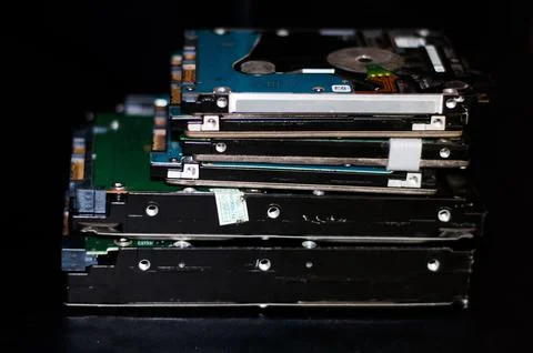 Stack of computer Hard disk drives and laptop Hard disk drives Stock Photos