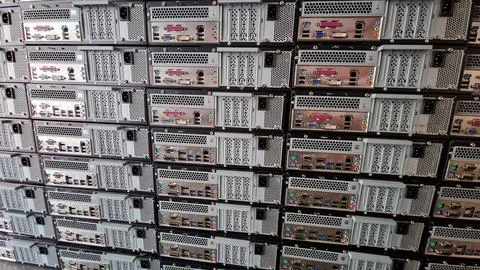 Stack of computers showing there plugs and ports Stock Photos