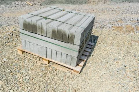 Stack of concrete curbstone close up Stock Photos
