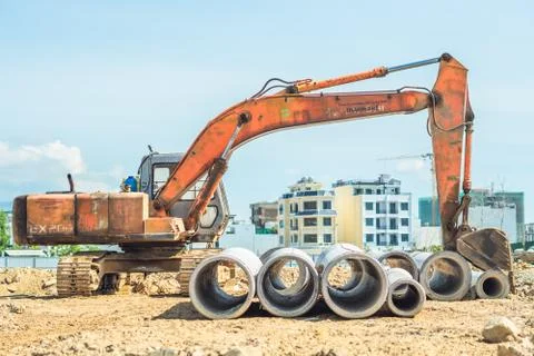 Stack of concrete drainage pipes for wells water discharges laying an external Stock Photos