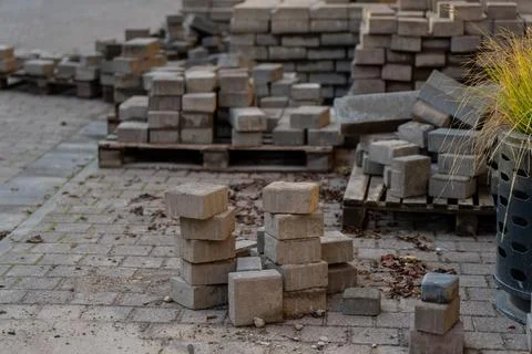 Stack of concrete paving blocks and construction materials Stock Photos