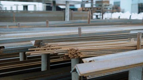 Stack of construction armature along with L-bars lying on industrial scrap yard Vídeo Stock 81818024