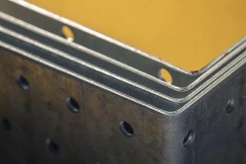 Stack of construction perforated steel Stock Photos