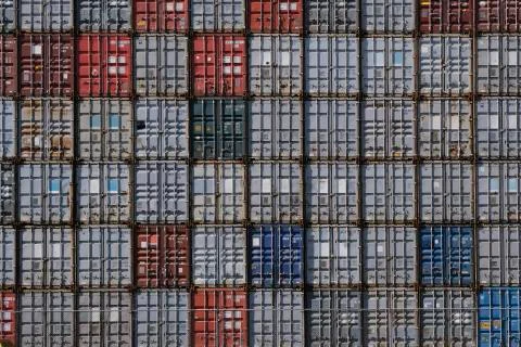 Stack of containers in harbor. Seamless texture industrial background Stock Photos