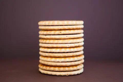 Stack of cookies on the dark brown background Stock Photos