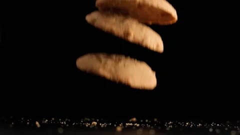 Stack of cookies falling on table. Video stock 160069177