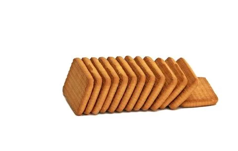 A stack of cookies is laid out on a white background. Foto stock