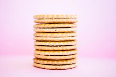 Stack of cookies on the pink background Stock Photos