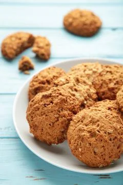 Stack of cookies on the plate on blue background Stock Photos