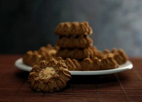 Stack of cookies in a plate on a table Stock Photos